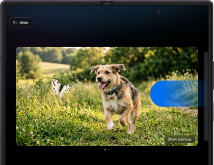 A Galaxy Z Fold displaying a photo of a dog running next to a generated butterfly.