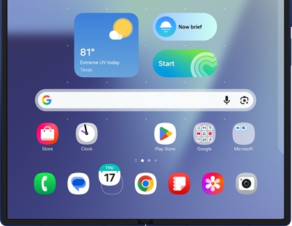 Galaxy Z Fold7 home screen showing the taskbar and several pinned apps at the bottom of the unfolded display.