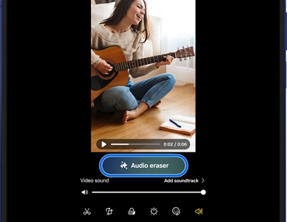 Video of a woman playing guitar being edited on a Galaxy Z Fold7 using the Audio eraser feature to remove background noise.