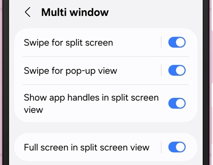 A Galaxy phone screen displaying Multi window settings with toggles turned on for split screen and pop up view options.