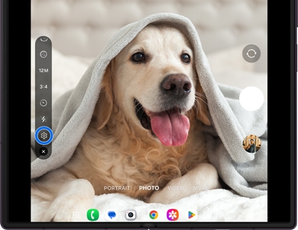 Galaxy Z Fold8 Ultra camera screen showing a dog under a blanket with a settings icon outlined in blue.