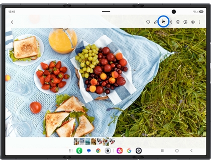 Unfolded Galaxy Z TriFold screen showing a picnic photo with the Galaxy AI icon highlighted in a blue circle.