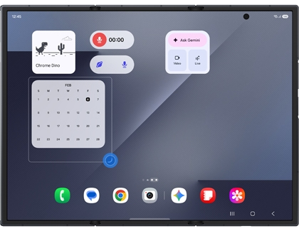 A Galaxy Z TriFold showing a calendar widget being resized using a blue handle at the bottom corner of the selection box.
