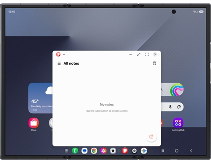 Home screen on the Galaxy Z TriFold with the Notes app displayed in a smaller window in the center
