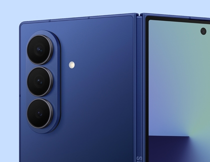 Close up of the Galaxy Z Fold7 in blue, showing the rear triple camera system and partially opened main screen.