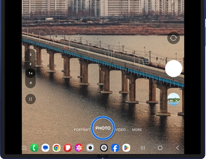 Camera interface on the Galaxy Z Fold7 showing the Photo mode with a bridge scene ready to capture.