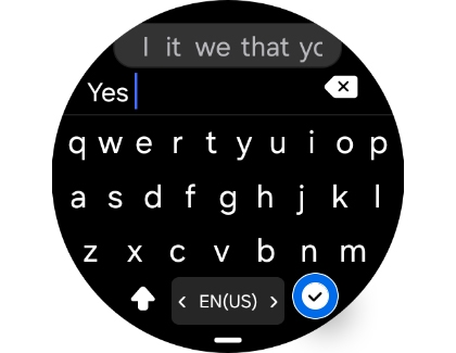 A Galaxy Watch screen showing a keyboard with the word Yes typed in the text field and a checkmark button highlighted.