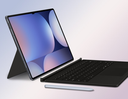 Galaxy Tab S10 Ultra with book cover keyboard and S Pen placed alongside each other