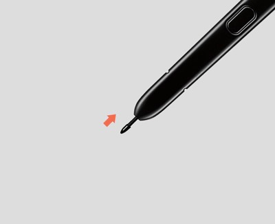 A close-up of an S Pen with the tip removed, indicated by a red arrow.