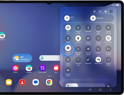 A Galaxy tablet quick settings panel showing the Wireless DeX icon highlighted by a blue circle over a blurred home screen background.