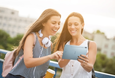 Two girls using a Galaxy Tab S6