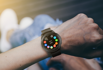 Galaxy Watch on wrist with apps screen displayed