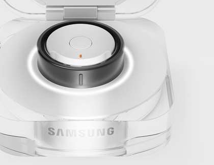 Galaxy Ring placed inside it's charging case with the lid opened