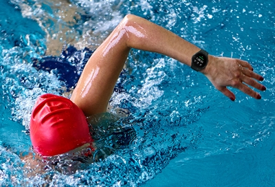 Man swimming with Water Lock Mode on his smart watch