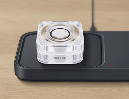 Galaxy Ring being charged on a wireless charging pad