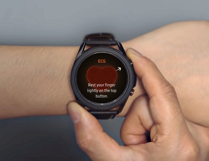 Person putting his finger on Samsung Health Monitor app on Galaxy Watch3