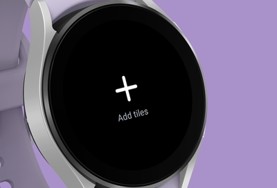 Samsung smart watch displaying the Add tiles option on Galaxy Watch5