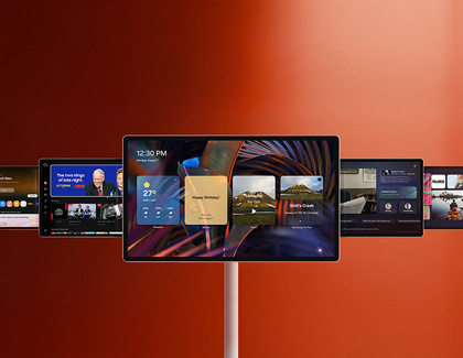 MovingStyle screen on a stand displaying a personalized UI menu against an orange background.