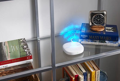 SmartThings Wifi Hub on shelf 