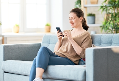 Woman using Google Assistant on phone