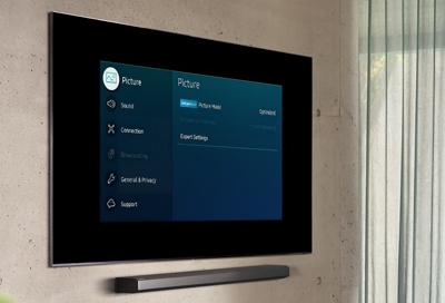 A Samsung TV in the living room with menu settings on the screen