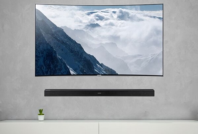 A soundbar below a Samsung TV