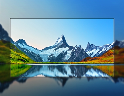 Mountain landscape with lake reflection shown on a Samsung TV using AI Picture feature.
