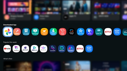 Various app icons like Google Photos on a Samsung Smart TV screen.