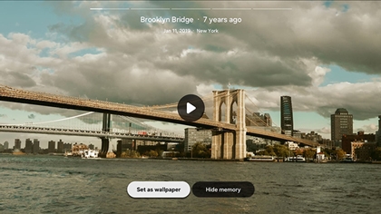 A Samsung Smart TV screen displaying a Google Photos memory of the Brooklyn Bridge with Set as wallpaperandHide memory buttons.