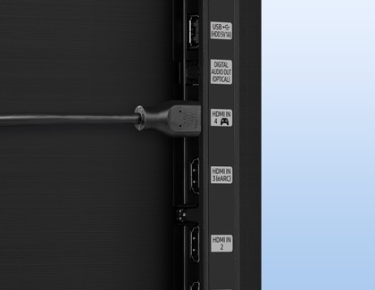Side view of a Samsung Smart TV showing HDMI and USB ports with a cable connected to HDMI 4.