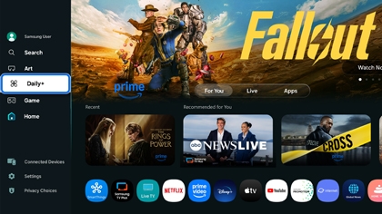Samsung TV home screen with menu panel open on the left selecting Daily Plus