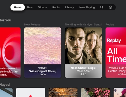 Apple Music interface on a Samsung TV showing music recommendations and trending releases.