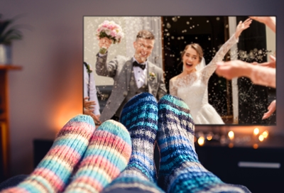 Couple watching their wedding picture using Ambient mode