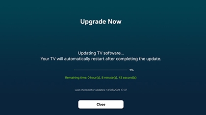 Samsung TV screen displaying the progress of the OS upgrade with a message indicating the software is updating, and the TV will restart upon completion.
