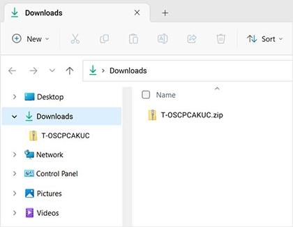 Windows file explorer showing the downloaded ZIP file named 'T-OSCPCACUK.zip' in the Downloads folder.