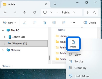 Windows computer showing the Paste option highlighted in the context menu.