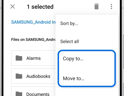Galaxy phone showing the file options menu with Copy to and Move to highlighted.