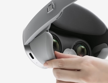 A hand attaching the Light Shields to the inside of a Galaxy XR headset.