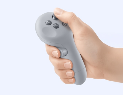 Hand holding the Galaxy XR controller while pressing the thumbstick.
