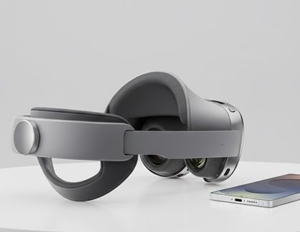 Galaxy XR headset placed beside a Galaxy phone on a table.