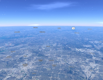 Aerial 3D view of a city landscape shown in Google Maps Immersive View.