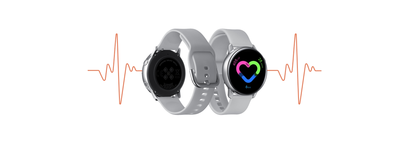 The silver Galaxy Watch Active seen from the back, next to an image of the front. On the watch face is a heart monitor visual. Behind the watch images is a thin red line of a heartbeat from an EKG. The silver Galaxy Watch Active seen from the back, next to an image of the front. On the watch face is a heart monitor visual. Behind the watch images is a thin red line of a heartbeat from an EKG.