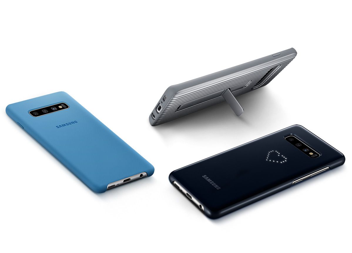 Image of three Galaxy S10 plus phones in various cases: Galaxy S10 plus in Prism White laying on its front with the Silicone Cover in Blue, Galaxy S10 plus in Prism White with the Rugged Protective Cover in Silver, with the kickstand out to hold it at an optimal viewing angle, and Galaxy S10 plus in Prism Black laying on its front with LED Cover in Black.