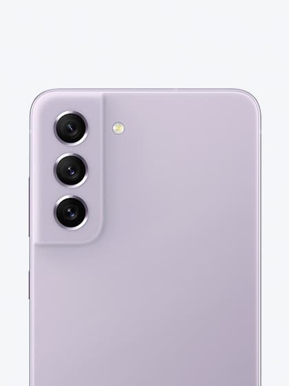 Galaxy S21 FE 5G in Lavender seen up-close from the rear, focused on its rear camera.