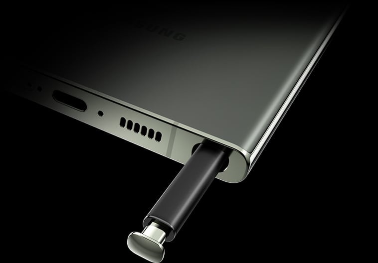 A close up of the bottom portion of Galaxy S23 Ultra, seen at an angle from the rear. The S Pen …