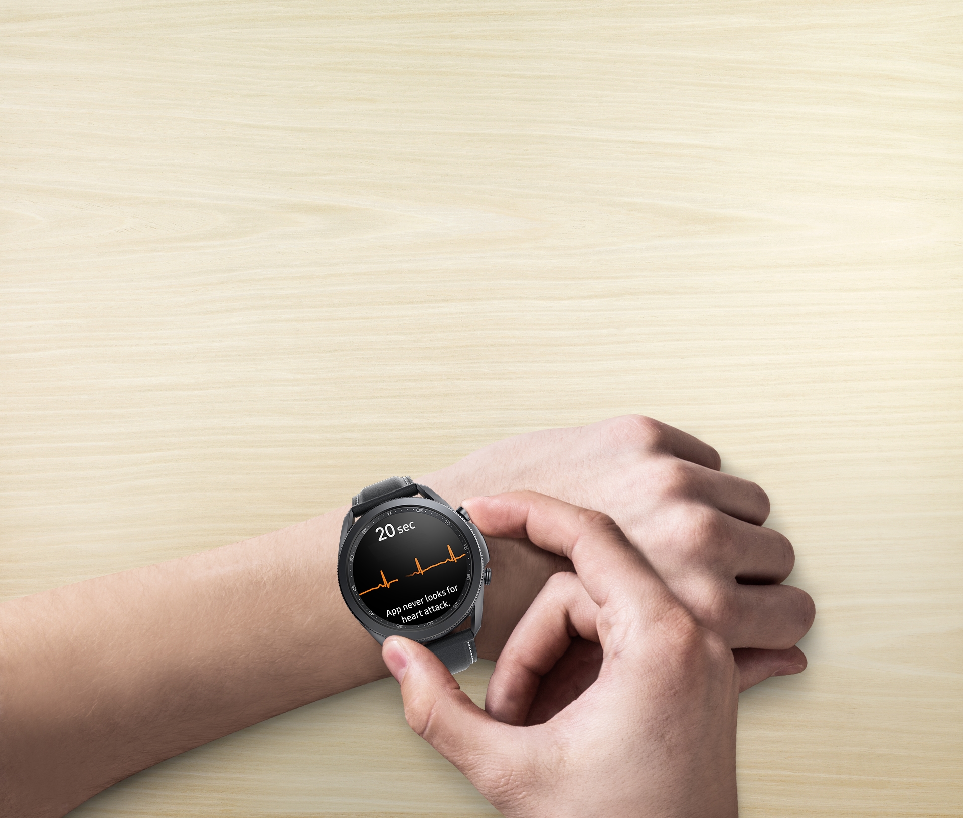 A view of an arm wearing the 45mm Galaxy Watch3 in Mystic Black. A hand presses a button on the side of the watch to measure ECG, with its GUI seen on the watch face.