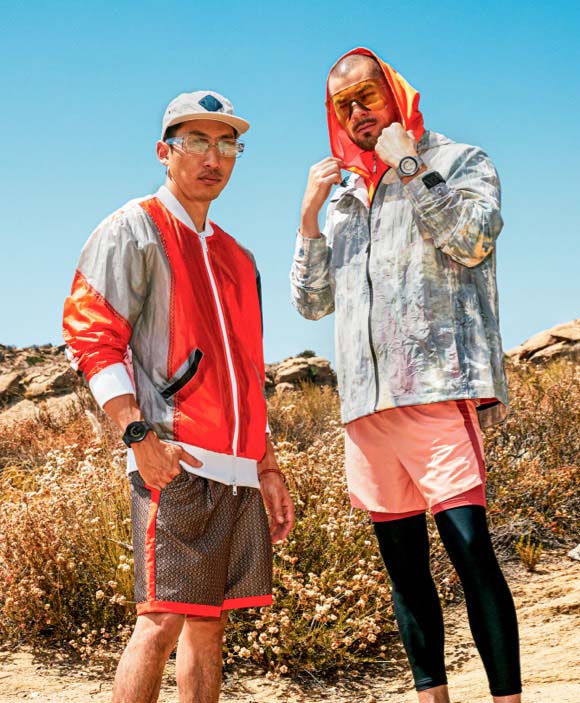 Two guys posing outdoors with orange urban outdoor wear and Watch5 Pro on their wrists.